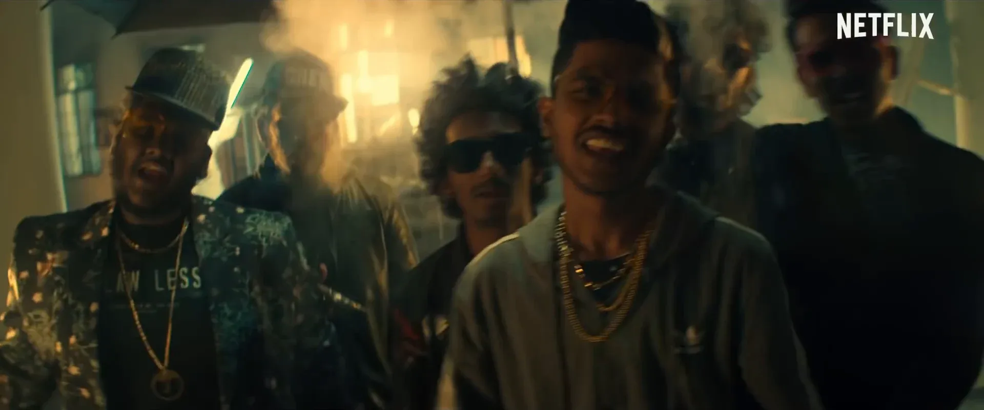 Performers on a dramatically lit set in the 7 BANTAIZ music video.